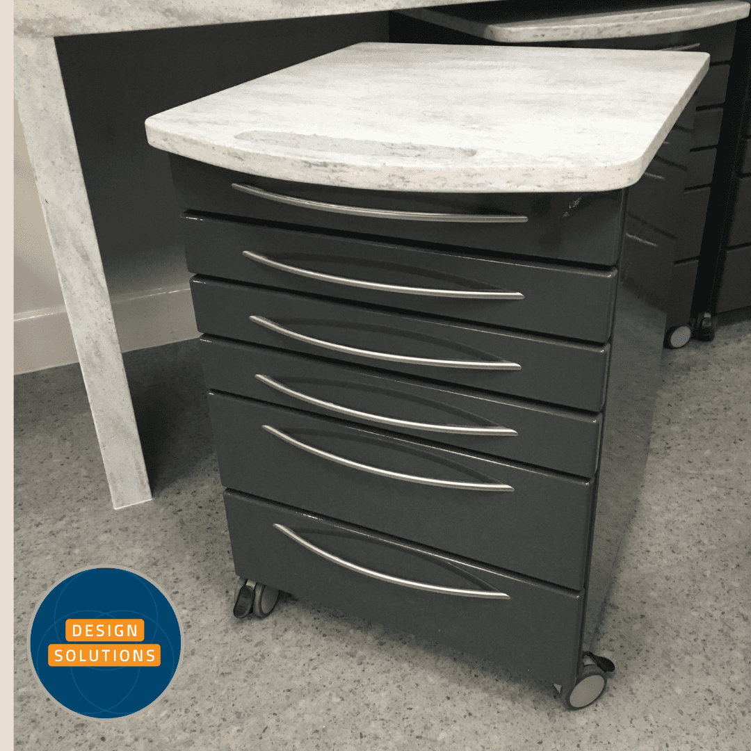 A Dental Mobile Cabinet in charcoal grey fronts and corian tops