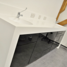 FAT Modern Dental Cabinetry with black gloss doors and white corian tops